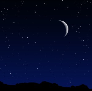 A starry night with a crescent moon.
